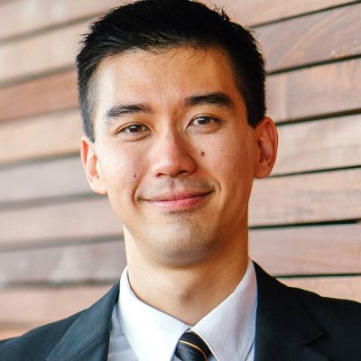 p12-400×400 Man in suit and tie smiles for photo