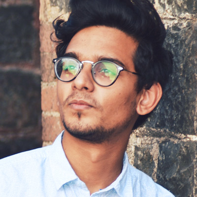p19 Man with glasses looks off into the distance
